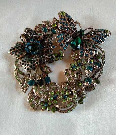 Broche vintage tipo art deco mariposa y flor cuajado piedras .Nuevo (106)
