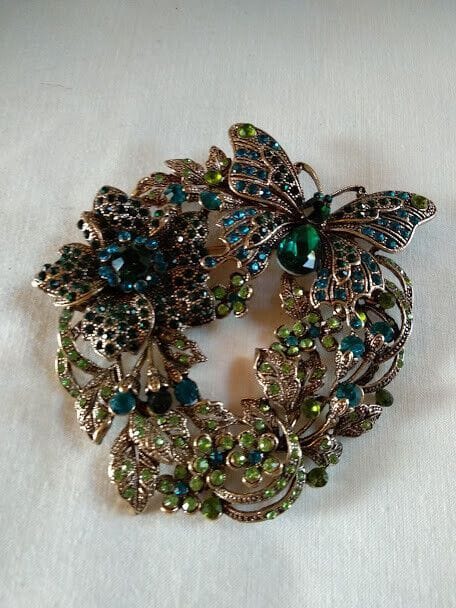 Broche vintage tipo art deco mariposa y flor cuajado piedras .Nuevo (106)
