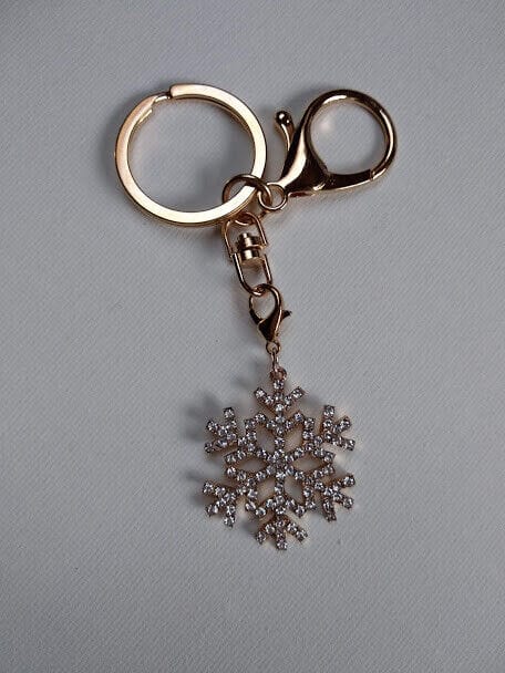 Llavero dorado con símbolo nieve cuajada de similes blancos Nuevo (102)