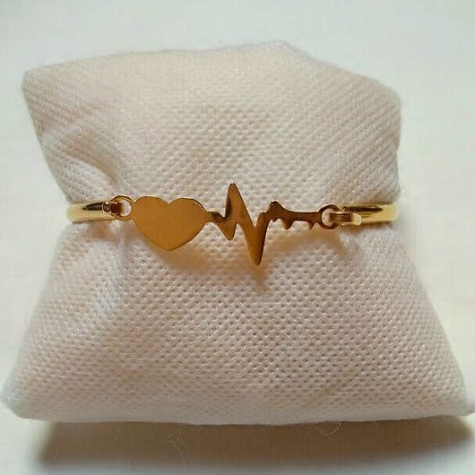 Pulsera acero mujer dorada rígida ritmo cardiaco y cierre nueva