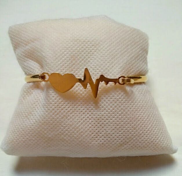 Pulsera acero mujer dorada rígida ritmo cardiaco y cierre nueva